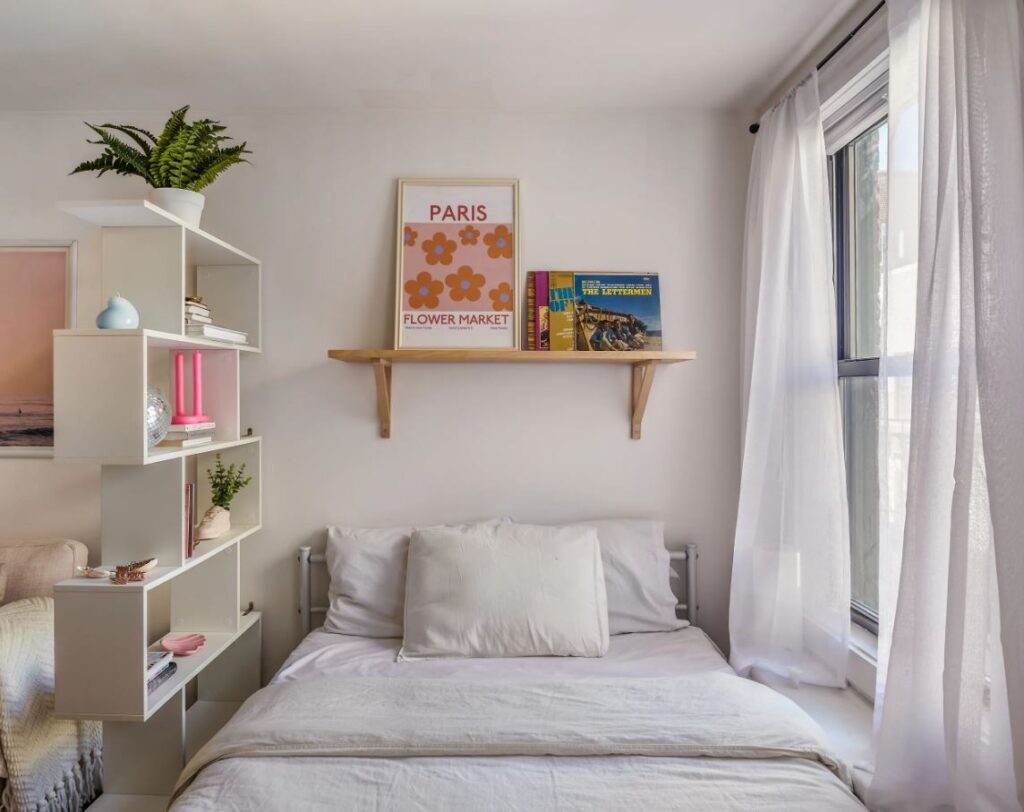 Wall shelves and hanging organizers in a small dorm room